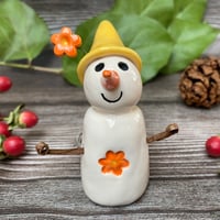 Image 1 of Handmade Ceramic Snowpeep with Yellow Hat/Orange Flowers
