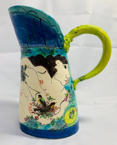 Image of Large jug with a green handle