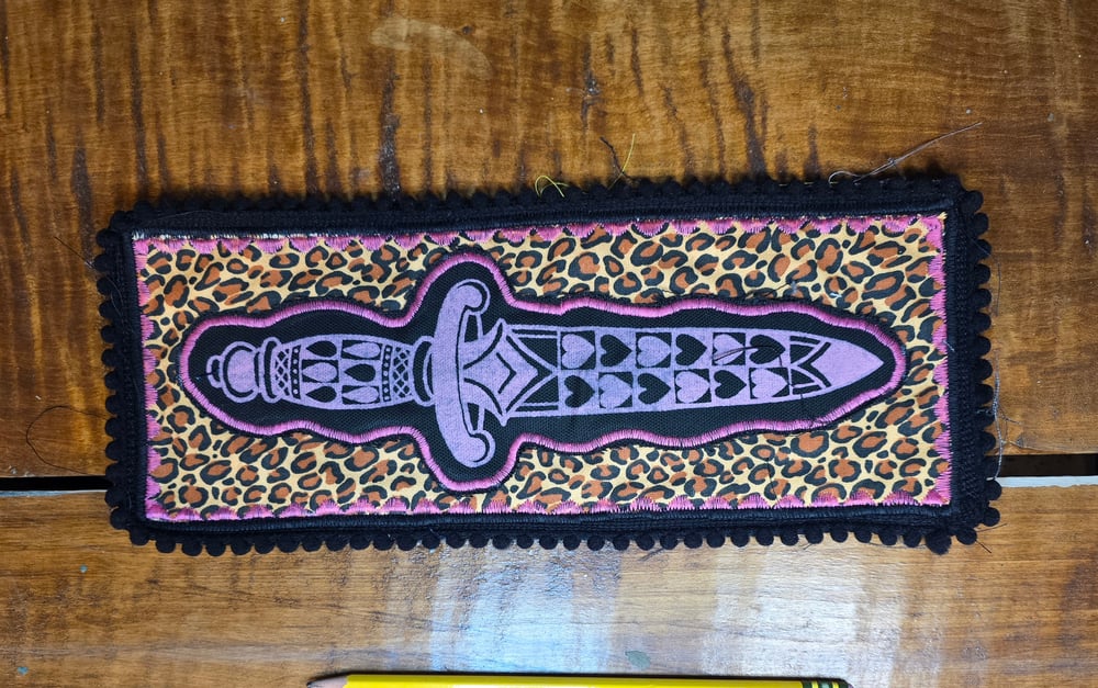 Leopard print dagger patch. 