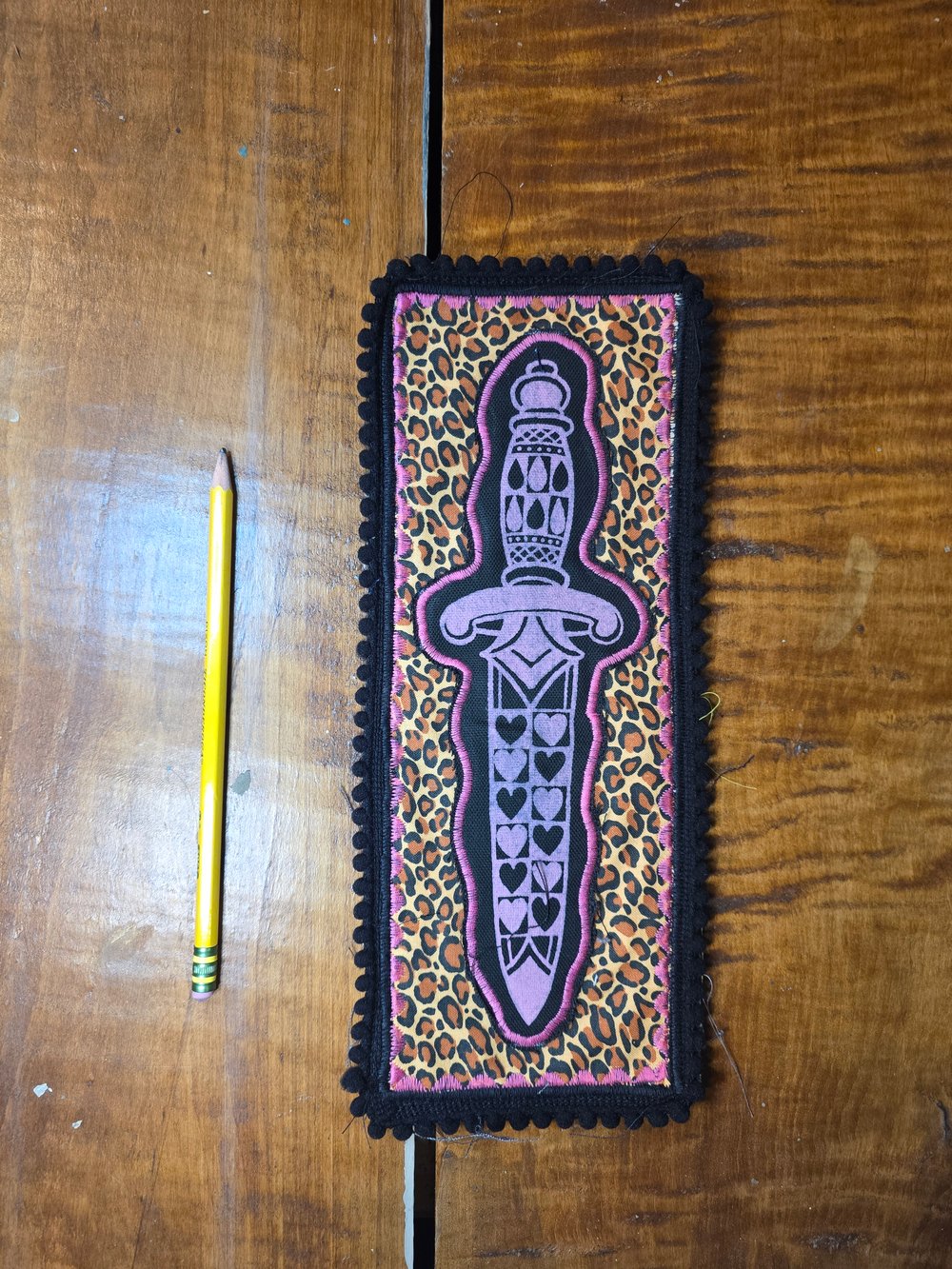 Leopard print dagger patch. 