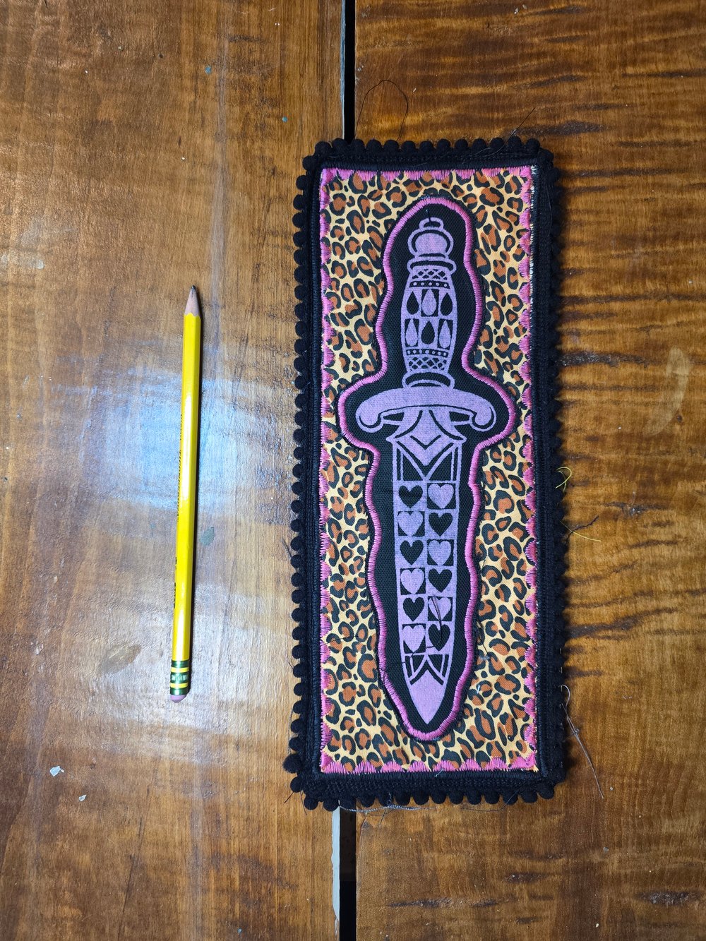 Leopard print dagger patch. 