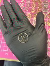 1 x silver metal. L.v. charm (4 LEFT TO PURCHASE)