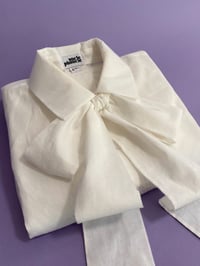 Image 15 of Ivory flower button bow blouse