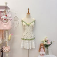 Image 1 of faux layer floral cami top