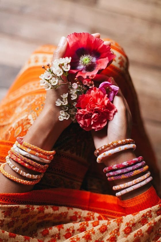 Image of Kharmari Flores naranjas.