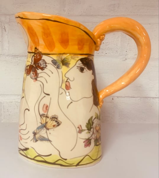 Image of Small orange and yellow jug