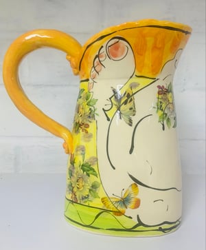 Image of Small orange and yellow jug