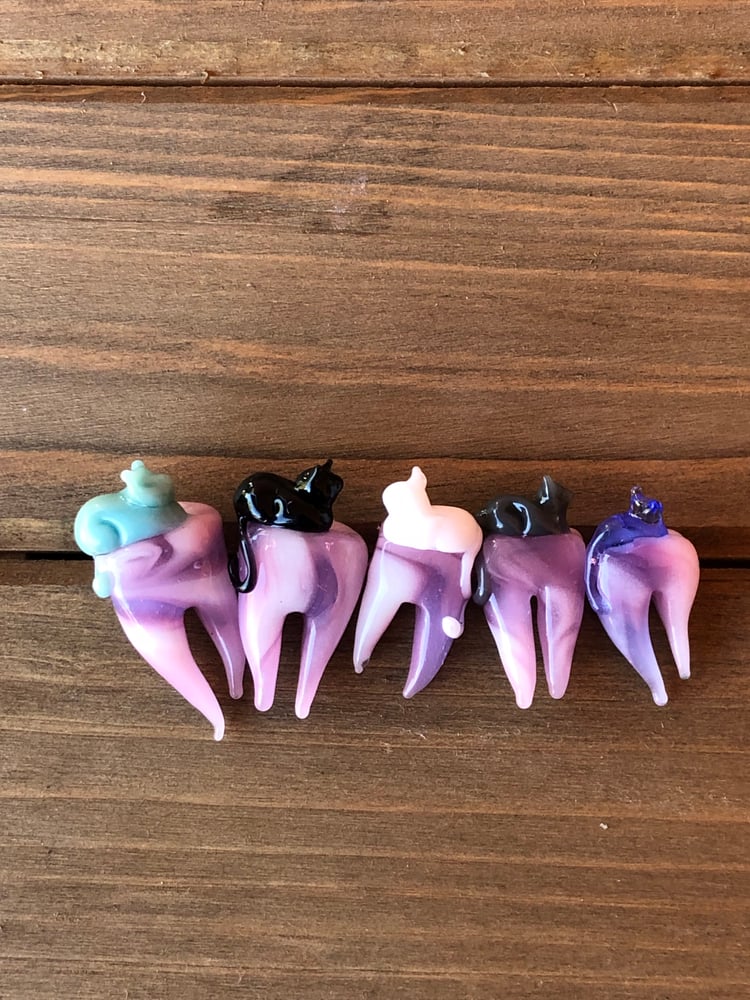 Image of tooth furry candy meow mix 