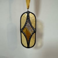 Image 1 of Iridescent orange diamond.