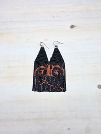 Black and copper pictograph