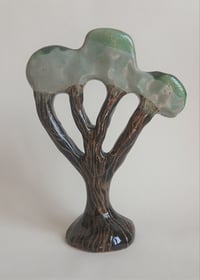 Textured trunk, green tree