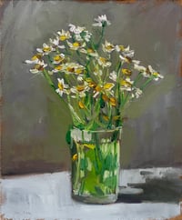 Daisies in glass