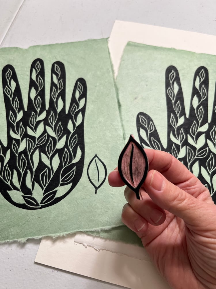 Image of Hand in Bloom (black on green)