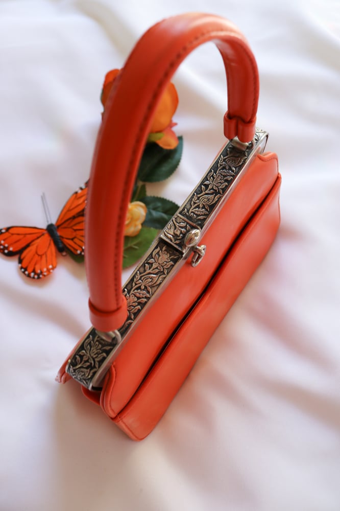 Image of Vintage Monarch Orange Clasp Purse with Floral Silver Details 