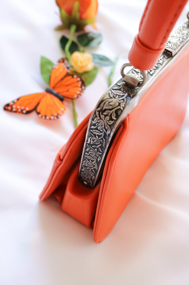 Image of Vintage Monarch Orange Clasp Purse with Floral Silver Details 