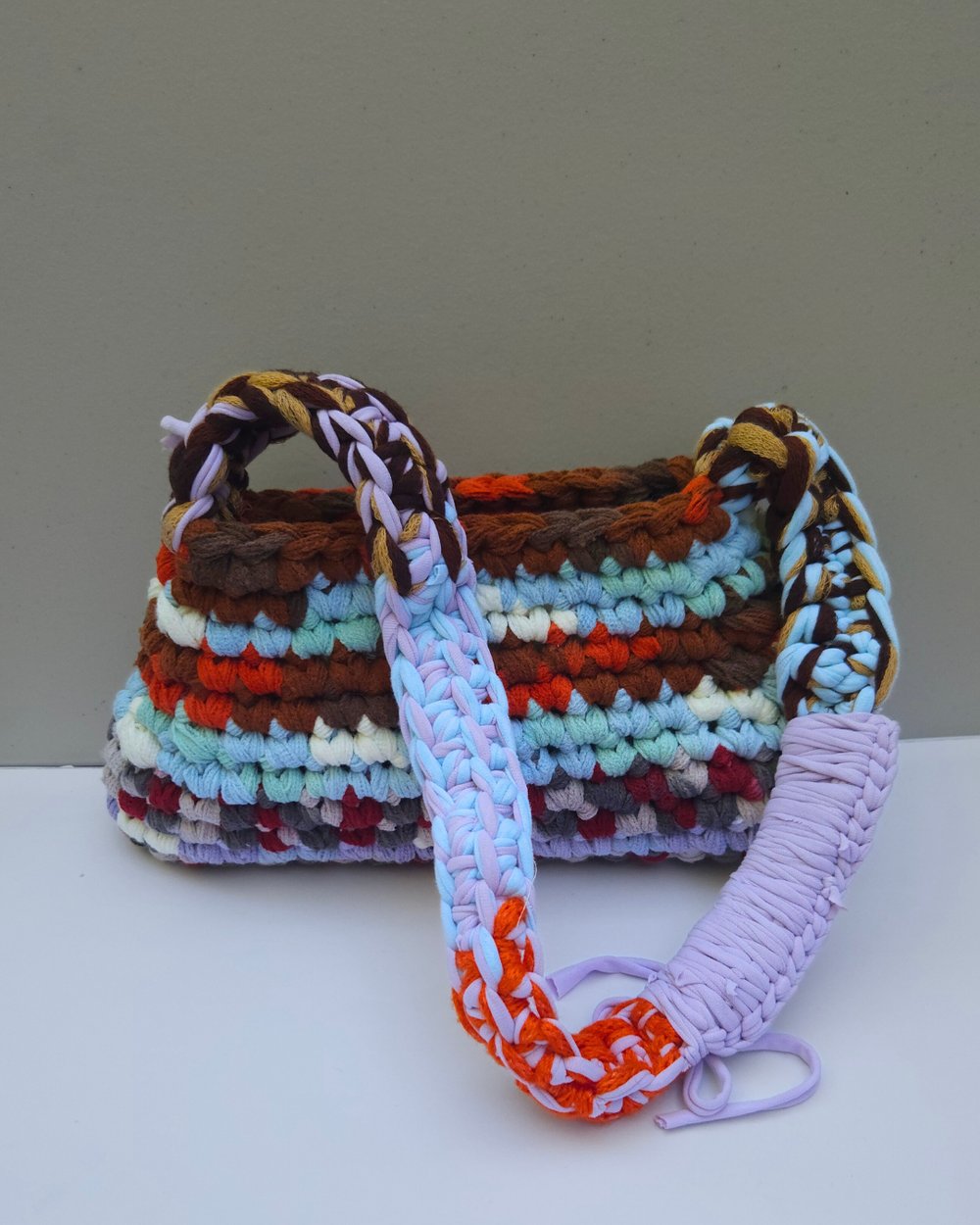 Image of PANSY – Chunky knit triangle over the should multicolour bag reclaimed yarn