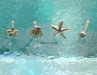 Image 1 of 14k nose stud (starfish, shell, flower, cz bezel)