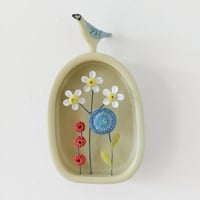 Image 1 of Ceramic Bird on Arched Frame