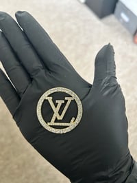 Gold diamanté metal L.v charm.