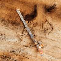 Image 1 of Octopus drinking straw. 