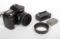 Image 1 of Nikon D90 DSLR Digital Camera + 35mm F1.8 G Lens + HB-46 + battery + charger
