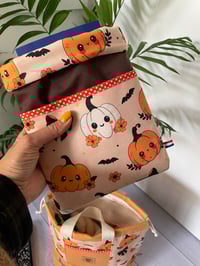 Image 1 of Pochette molletonnée pour livre de poche, avec petite poche avant: Citrouilles mignonnes