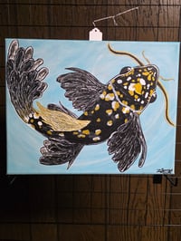 Golden Spotted Koi in Motion