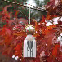 Image 1 of little saint decoration