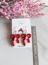 Image 5 of Holiday Coquette Bow Clay Earrings