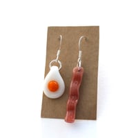 Image 1 of Handmade glass egg and bacon dangle earrings on silver hooks quirky and unique