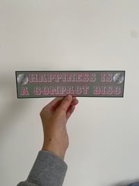 Happiness is a compact disc 