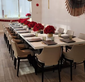 Image of Red flower low flower centerpiece in 5inch x 5 inch vase 