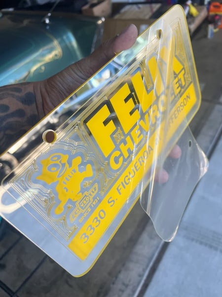 Image of CHROME & YELLOW FELIX CHEVROLET ICONIC LICENSE PLATE