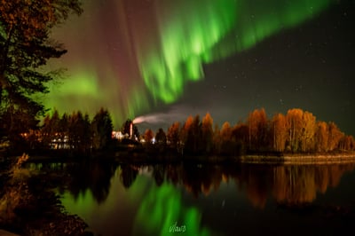 Image of Aurora dancing  over a lake