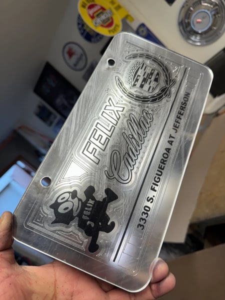 Image of CHROME & BLACK FELIX CADILLAC ICONIC LICENSE PLATE