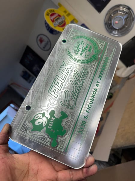 Image of CHROME & GREEN FELIX CADILLAC ICONIC LICENSE PLATE