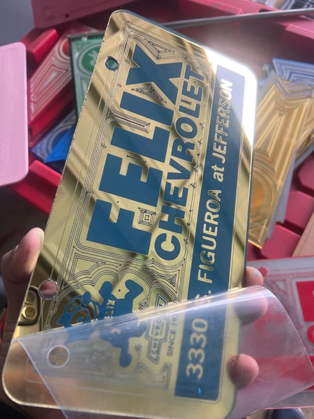 Image of GOLD & BLUE FELIX CHEVROLET ICONIC LICENSE PLATE
