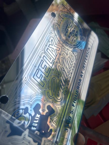 Image of CHROME & BLUE FELIX CADILLAC ICONIC LICENSE PLATE