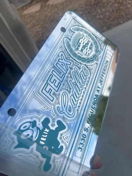 Image of CHROME & LIGHT BLUE FELIX CADILLAC ICONIC LICENSE PLATE