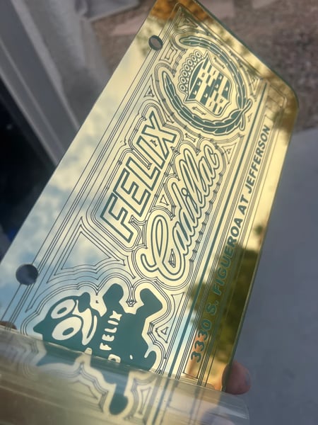 Image of GOLD & LIGHT BLUE FELIX CADILLAC LICENSE PLATE