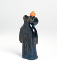 Image 3 of Orange Floating in Water