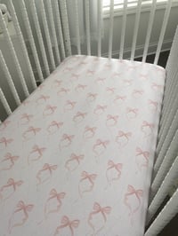 Image 1 of Adorable Pink Bow Cotton Fitted Crib Sheet- Perfect for Baby's Nursery