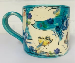 Image of Teal green figurative cylinder mug