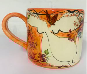 Image of Bright orange cylinder figurative mug
