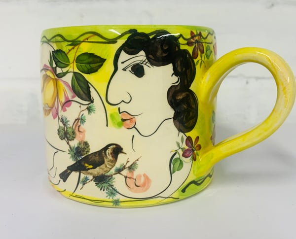 Image of Bright yellow cylinder figurative mug