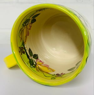 Image of Bright yellow cylinder figurative mug