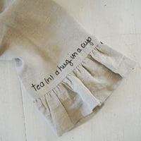 Image 1 of ruffled linen towel - tea (n.) a hug in a cup