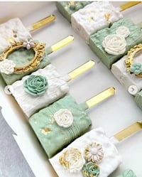 Image 1 of Sage green, white, and gold treat package