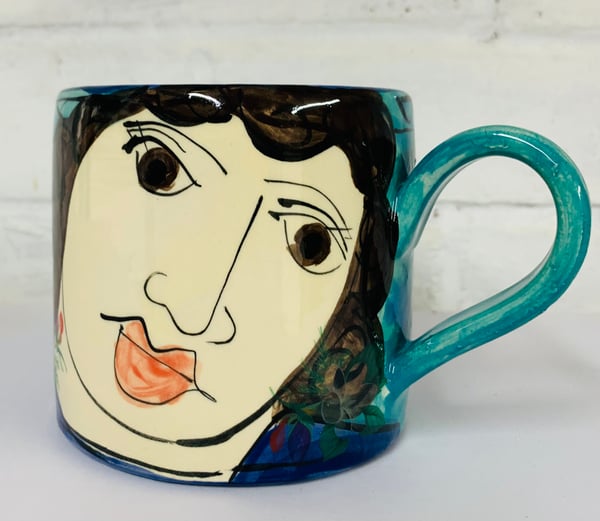 Image of Teal and blue face cylinder mug