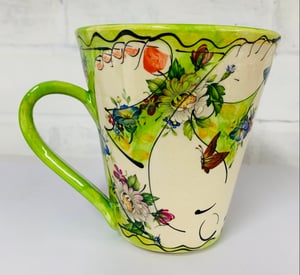 Image of Tall green figurative mug